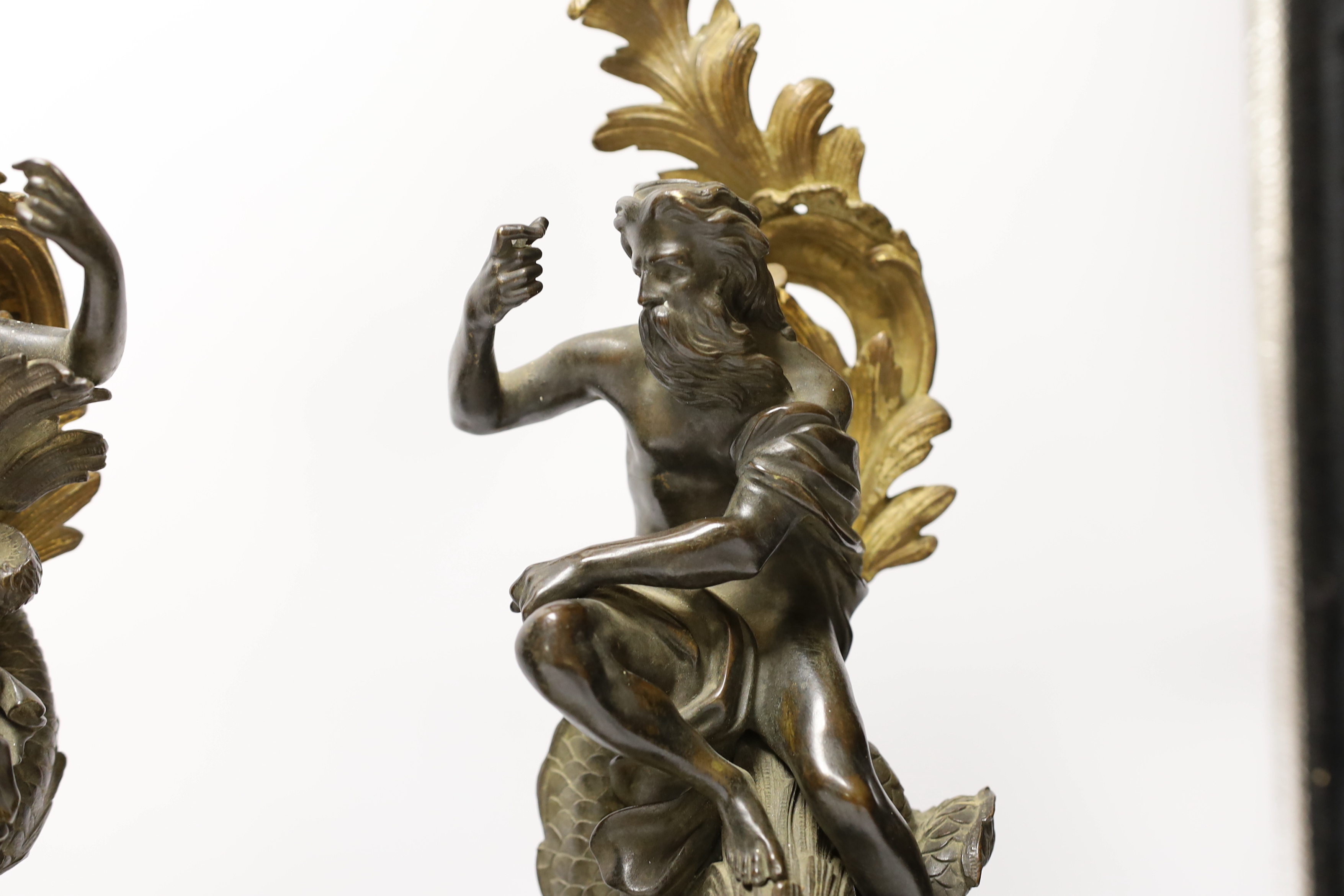 A pair of late 19th century bronze and ormolu figures of Poseidon and Amphitrite, 39cm